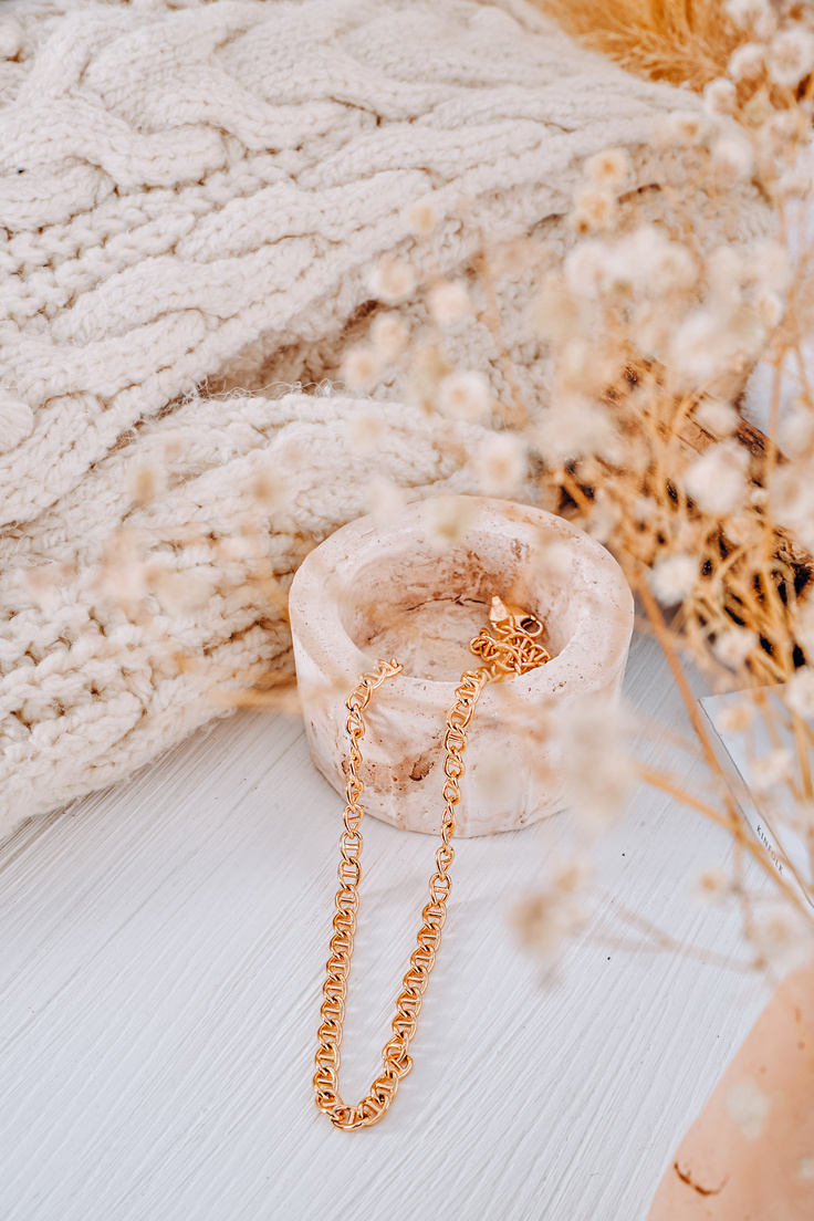 Jewellery next to Sweater